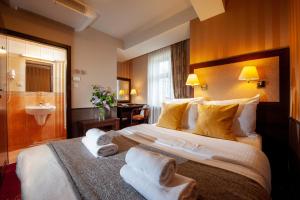 Posteľ alebo postele v izbe v ubytovaní Hotel Wielopole