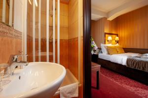 Posteľ alebo postele v izbe v ubytovaní Hotel Wielopole