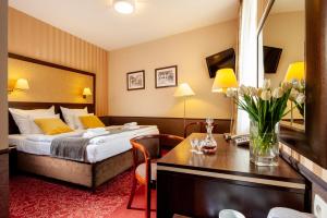 Posteľ alebo postele v izbe v ubytovaní Hotel Wielopole