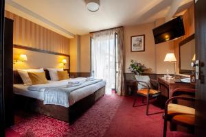 Posteľ alebo postele v izbe v ubytovaní Hotel Wielopole