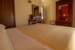 Postel nebo postele na pokoji v ubytování Hotel Gangi