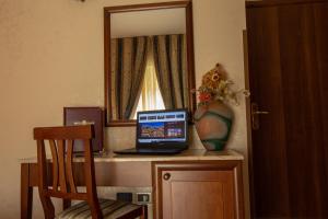 TV a/nebo společenská místnost v ubytování Hotel Gangi
