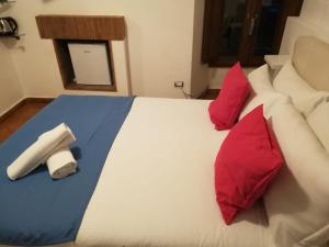 Cama o camas de una habitación en Relais Arco Della Pace