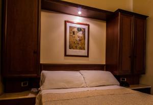 Postel nebo postele na pokoji v ubytování Hotel Gangi
