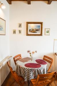 a dining room with a table and two chairs at Apartment Zoja in Pinezici +38 photos
