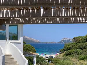 a house with a view of the beach at VILLA ARANZOS in Golfo Aranci