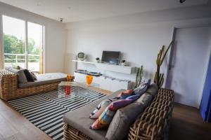 a living room with two couches and a table at The Sparkling Castle in Reims