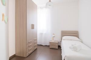 A bed or beds in a room at Casa Tiziana - ApulianStay Group