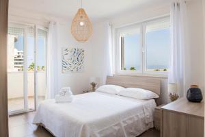 A bed or beds in a room at Casa Tiziana - ApulianStay Group