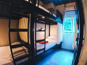 Postel nebo postele na pokoji v ubytování CabanaCopa Hostel