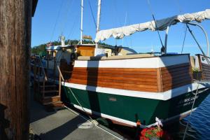 a boat docked at a dock in the water at Wharfside Bed & Breakfast in Friday Harbor