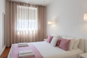 A bed or beds in a room at Casa Marquês