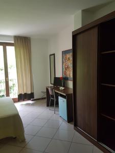 Postel nebo postele na pokoji v ubytování Hotel & Residence La Sibilla Cusiana