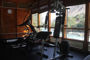 a gym with two tread machines and a window at El Molino Hotel y Restaurant in Lunahuaná