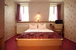 Postel nebo postele na pokoji v ubytování Astoria Hotel