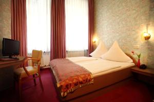 Postel nebo postele na pokoji v ubytování Astoria Hotel