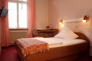 Postel nebo postele na pokoji v ubytování Astoria Hotel