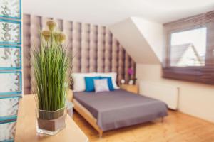 Posteľ alebo postele v izbe v ubytovaní Apartman Szanyi
