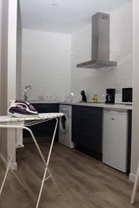 A kitchen or kitchenette at APARTAMENTOS GyC VIVIENDAS GOLD