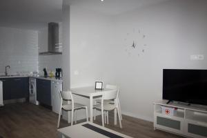 A kitchen or kitchenette at APARTAMENTOS GyC VIVIENDAS GOLD
