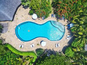 an aerial view of a swimming pool with a resort at Spice Island Hotel & Resort in Jambiani