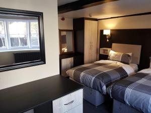 
Cama o camas de una habitación en Old Black Horse Inn
