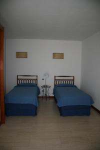 Postel nebo postele na pokoji v ubytování Hotel Villa Undulna - Terme della Versilia