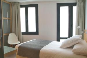 Кровать или кровати в номере Le Petit Boutique Hotel