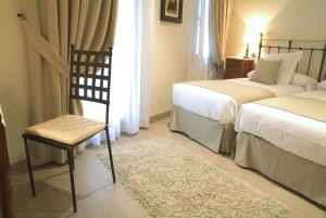 Кровать или кровати в номере Le Petit Boutique Hotel