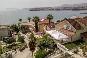 an aerial view of a city with a lake at Pansion Casa in Podstrana