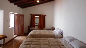 Voodi või voodid majutusasutuse Casa Inka B&B toas