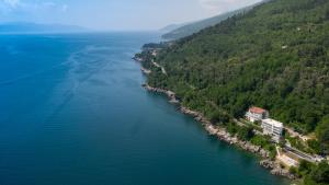 an aerial view of a river near a forest at Boutique Hotel Acacia in Lovran