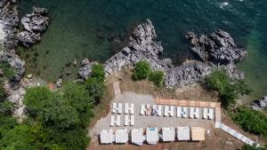 an aerial view of a building next to the water at Boutique Hotel Acacia in Lovran