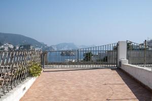 a balcony with a fence and a view of the water at Renato Canalone in Ponza