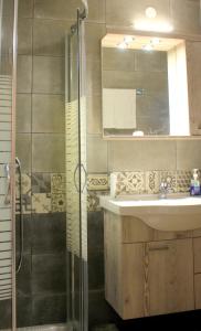 a bathroom with a sink and a shower at EVANNA HOUSE in Symi +20 photos