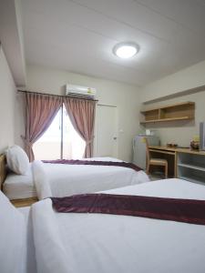 P Park Residence Charansanitwong tesisinde bir odada yatak veya yataklar
