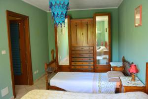 A bed or beds in a room at Casa Omnia B&B Még 19 kép