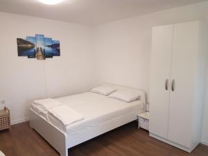 Posteľ alebo postele v izbe v ubytovaní Apartments Jungic, Rab