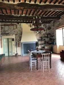 a dining room with a table and chairs at La Calona in Camaiore