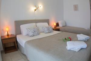 Posteľ alebo postele v izbe v ubytovaní HOTEL BARA