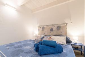 Posteľ alebo postele v izbe v ubytovaní AnSe' casa vacanze