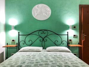 Ліжко або ліжка в номері Agriturismo il Cicaleto
