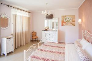 A bed or beds in a room at La cicala stonata