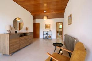a living room with a vanity and a mirror at House Pauline in Labin
