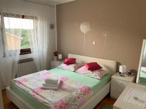Postel nebo postele na pokoji v ubytování Apartments Stojanovic