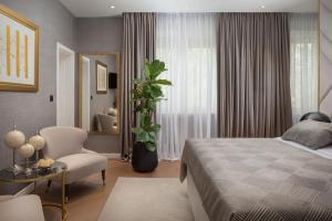 Postel nebo postele na pokoji v ubytování Five Elements Luxury Rooms