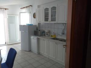 Kuchyň nebo kuchyňský kout v ubytování Apartments Rosa