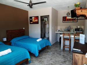 Postel nebo postele na pokoji v ubytování Holbox Isla Bonita