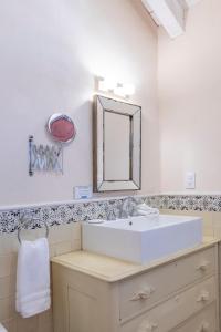 a bathroom with a white sink and a mirror at La Casa Azul Huasca in Huasca de Ocampo