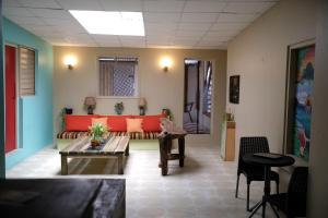 a living room with a couch and a table at Ragamuffin Hostel in Kingston